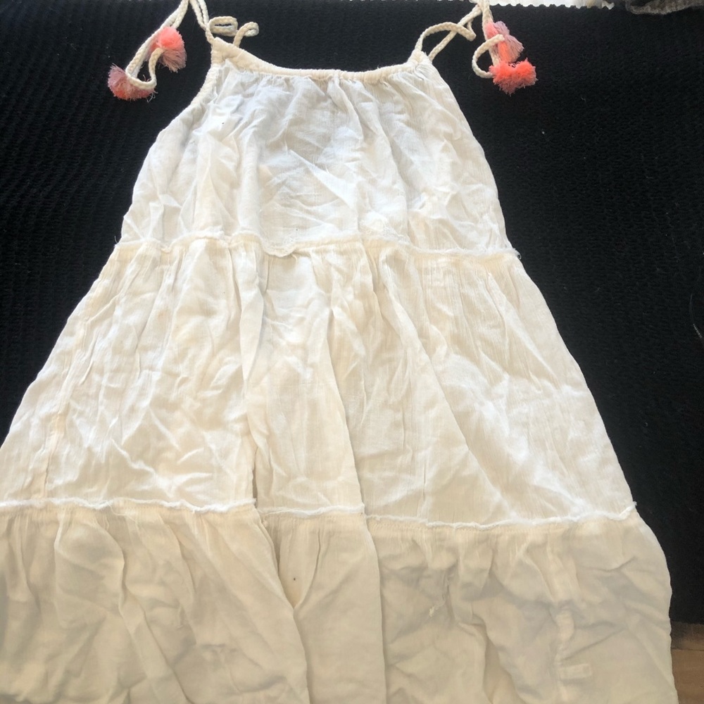 White beach coverup with adjustable straps